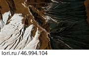 Aerial of wide gorge with rocky cliffs from both sides of small canyon. Стоковое фото, фотограф David Kashakhi / Фотобанк Лори