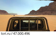 Embarking on a thrilling desert adventure in the spectacular Wadi Rum landscape is unforgettable. Стоковое фото, фотограф David Kashakhi / Фотобанк Лори