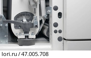 Close-up of conveyor machine with pressure indicator. Стоковое фото, фотограф David Kashakhi / Фотобанк Лори