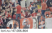 Serbia - Belgrade, august 23, 2022: Fans gather in a stadium to cheer for their favorite sports team on a sunny day. Редакционное фото, фотограф David Kashakhi / Фотобанк Лори