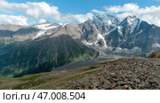 View from the hill top of endless snow capped mountain range. Стоковое фото, фотограф David Kashakhi / Фотобанк Лори