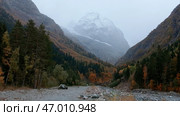 Huge mountains overgrown with forests around where cold springs beat. Стоковое фото, фотограф David Kashakhi / Фотобанк Лори