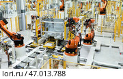 Fast-working robots that work in production. Редакционное фото, фотограф David Kashakhi / Фотобанк Лори
