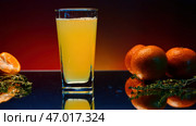 Elegant alcoholic cocktail on a bar counter with oranges and rosemary. Стоковое фото, фотограф David Kashakhi / Фотобанк Лори
