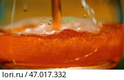 Close up of transparent glass and alcohol drink. Стоковое фото, фотограф David Kashakhi / Фотобанк Лори