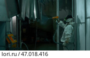 Process of powder coating of metal parts at a steel factory. Стоковое фото, фотограф David Kashakhi / Фотобанк Лори