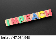 Кубики со словом IMPEACH на темном фоне. Стоковое фото, фотограф Pixel_shot / Фотобанк Лори