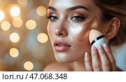 Young woman applies highlighter on her face using a makeup sponge in a softly lit environment with bokeh background. Стоковое AI-изображение, AI-художник Сергей Толмачёв / Фотобанк Лори