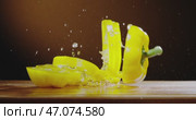 An Elegant Wooden Surface Captured with Dramatic yellow pepper drops on wooden surface. Стоковое видео, видеограф Владимир Ковальчук / Фотобанк Лори