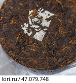 Aged Puerh Tea Cake that boasts deep, rich aromas and complex flavors you will love. Стоковое фото, фотограф David Kashakhi / Фотобанк Лори