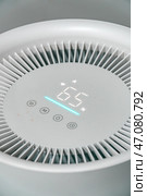 The Modern Air Purifier features an advanced Control Panel with a sleek Digital Display. Стоковое фото, фотограф David Kashakhi / Фотобанк Лори