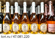Bottled alcoholic sparkling beverages Campo del Passo prosecco on the shelf in a superstore. Редакционное фото, фотограф FotograFF / Фотобанк Лори