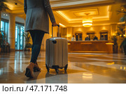 A traveler arriving at a luxury hotel. The traveler carries an elegant suitcase. Стоковое AI-изображение, AI-художник Ирина Ручушкина / Фотобанк Лори