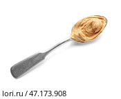 Ложка с вкусным арахисовым маслом на белом фоне. Стоковое фото, фотограф Pixel_shot / Фотобанк Лори