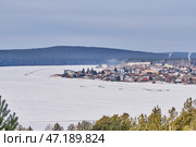 Winter Landscape of Small Town by Frozen Lake, Sysert, Russia. Стоковое фото, фотограф Ирина Кононова / Фотобанк Лори
