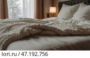The interior of a modern house. A minimalistic cozy beige bedroom interior with a plaid, pillows, a headboard, linen linens and a bedside table. Стоковое AI-изображение, AI-художник Photojuli / Фотобанк Лори