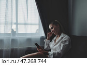 Mindful Moments of Reflection and Connection in a Cozy, Soft-Lit Room. Стоковое фото, фотограф Aleksandr Golubev / Фотобанк Лори