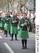 St. Patrick's day celebration parade - musicians in Irish kilts with bagpipes marching in the street (2024 год). Редакционное фото, фотограф Дмитрий Рухленко / Фотобанк Лори