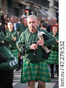 St. Patrick's day celebration parade - musicians in Irish kilts with bagpipes marching in the street (2024 год). Редакционное фото, фотограф Дмитрий Рухленко / Фотобанк Лори