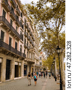 Barcelona, Spain - September 03, 2023: Picturesque avenue Paseo de Gracia in center of Barcelona in autumn in Eixample district. Редакционное фото, фотограф Яков Филимонов / Фотобанк Лори