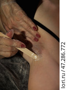 Effective Body Hair Removal Technique Being Performed Indoors With Precision and Care. Стоковое фото, фотограф Aleksandr Golubev / Фотобанк Лори