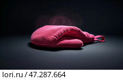 Bright pink oven mitt resting on a dark surface capturing the essence of kitchen tools for cooking and baking tasks. Стоковое AI-изображение, AI-художник Сергей Толмачёв / Фотобанк Лори