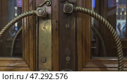 Discovery, enter, entry, front, gold, hole, key, open, ornate, room, security, shiny, steel, bell, close, design, detail, doorknob, house, metal, object, old, wood, architecture, background, brown, closeup, wooden. Стоковое видео, видеограф Zita Khasanova / Фотобанк Лори