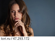 Captivating Elegance Captured in a Serene Studio With a Thoughtful Model. Стоковое фото, фотограф Aleksandr Golubev / Фотобанк Лори