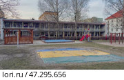 Playground Area Located in Close Proximity to a School Building for Various Activities. Стоковое видео, видеограф Vladimir Vintonjak / Фотобанк Лори