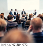 Interview and round table discussion at business convention and presentation. Audience at the conference hall. Business and entrepreneurship symposium. Стоковое фото, фотограф Matej Kastelic / Фотобанк Лори
