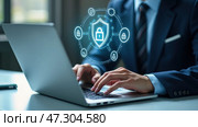Man is typing on a laptop with a blue screen that has a security symbol on it. Стоковое AI-изображение, AI-художник Sergey Grishin / Фотобанк Лори