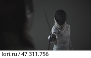Fencing - two person in a white protective suits and helmets starts training. Стоковое видео, видеограф Константин Шишкин / Фотобанк Лори