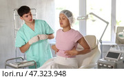 Female patient and her doctor had extensive dialogue regarding breast procedure, ensuring all aspects of surgery were thoroughly addressed. Стоковое видео, видеограф Яков Филимонов / Фотобанк Лори