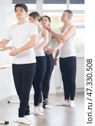Young ballet dancer practicing at group class with choreographer. Стоковое фото, фотограф Яков Филимонов / Фотобанк Лори