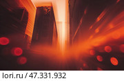 Urban alley illuminated by warm orange light during evening, creating a dramatic atmosphere through the narrow passageway. Стоковое AI-изображение, AI-художник Сергей Толмачёв / Фотобанк Лори