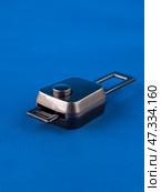 Close up of mobile seat belt extender on blue background. Стоковое фото, фотограф Виталий Сова / Фотобанк Лори