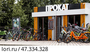 A bicycle or scooter rental point or point. Rent, hire, business. Russia, Moscow region, June 23, 2024. Редакционное фото, фотограф Photojuli / Фотобанк Лори