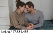 Loving mature couple interactions at home. Man and woman embracing, hugging, holding hands and dancing. Wife with husband intimate moments. couple is touching, cuddling, kissing. Natural lighting. 4K. Стоковое видео, видеограф Марина Демидюк / Фотобанк Лори