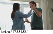 Emotional Dance. Middle-aged Couple Dancing Together Embrace at Home. Mature Couple dancing bonding, smiling and moving to the rhythm in a romantic vibe enjoying their anniversary. Active relationship. Стоковое видео, видеограф Марина Демидюк / Фотобанк Лори