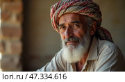 A Yemeni man deep in thought, embodying wisdom and experience. The rustic surroundings highlight a blend of tradition and life, reflecting stories untold Generative AI. Стоковое AI-изображение, AI-художник Юлия Петровская / Фотобанк Лори