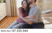 Mature couple hugging hugging each other kissing at home bedroom. Intimate Moment. Tender embrace shared between a loving middle age man and woman, husband and wife. Deep love. Low key, cinematic. Стоковое видео, видеограф Марина Демидюк / Фотобанк Лори