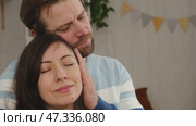 Loving mature couple interactions at home. Man and woman embracing, hugging, holding hands and dancing. Wife with husband intimate moments. couple is touching, cuddling, kissing. Natural lighting. 4K. Стоковое видео, видеограф Марина Демидюк / Фотобанк Лори