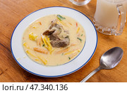 Sopa de mani is peanut soup made with beef, beef bones, potatoes and peas as main ingredients. Latin American cuisine. Стоковое фото, фотограф Яков Филимонов / Фотобанк Лори