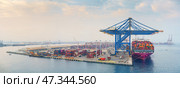 Jeddah, Saudi Arabia - Mar 08 2023,  panoramic aerial view, A large container ship "ONE" is unloading in the port of Jeddah, Saudi Arabia. Редакционное фото, фотограф Сергей Богомяко / Фотобанк Лори