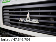 Moscow, Russia - March 26, 2025 - A Modern Maz Truck With A Hydraulic Crane Is Ready For Operation. Редакционное фото, фотограф Кутина Татьяна / Фотобанк Лори