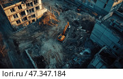 A devastated construction site or demolition zone. Several old buildings have been partially dismantled, exposing exposed concrete structures and reinforcement. In the center of the frame, an excavator is working, clearing away piles of construction debris and earth. The surface of the site is uneven, with remnants of brick, concrete, and wooden beams. The lighting is evening, with the warm glow of the setting sun adding drama and a sense of closure. The view from above emphasizes the scale and chaos of the scene. Стоковое AI-изображение, AI-художник Анна Кривицкая / Фотобанк Лори