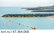 Sir Bani Yas Island, United Arab Emirates - Jan 18 2024, panoramic view of the coast of the island, the beach, breakwaters and restrictive buoys on the water, at daytime, Sir Bani Yas Island, UAE. Стоковое фото, фотограф Сергей Богомяко / Фотобанк Лори