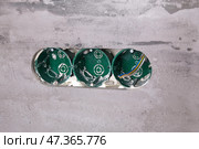 Three electrical boxes for conduits are built into the wall. Work on installing electrical outlets. Стоковое фото, фотограф Виктория Тельминова / Фотобанк Лори