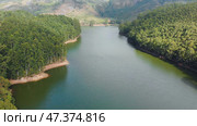 Aerial view beautiful nature with mountains and hills by Lake Mattupetty. Kerala State. Near the city of Munar. Стоковое фото, фотограф Mikhail Davidovich / Фотобанк Лори