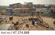 Mumbai, India - December 17, 2018 Dharavi slums in east Mumbai. Bandra District, Maharashtra, India. Редакционное фото, фотограф Mikhail Davidovich / Фотобанк Лори